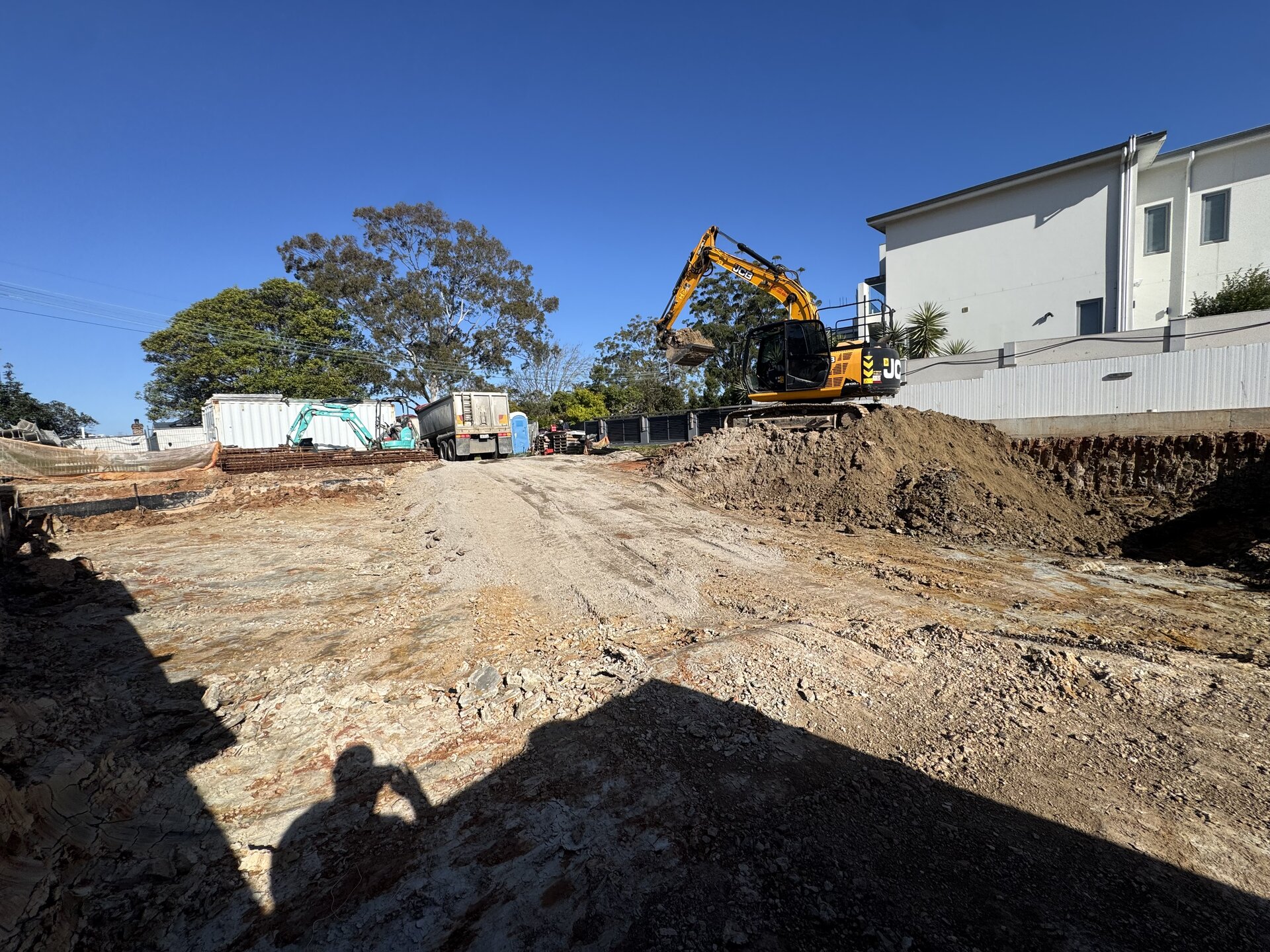 JCB excavator on a bulk rock excavation in progress, Strathfield NSW